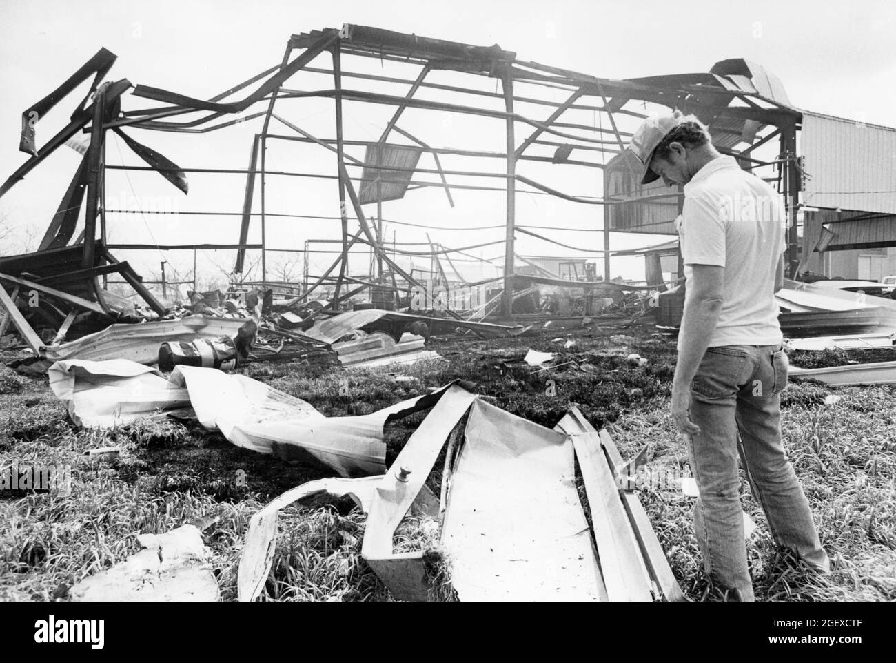 Kyle Texas USA, circa 1984: Metal skeleton of warehouse damaged by explosion. ©Bob Daemmrich Stock Photo