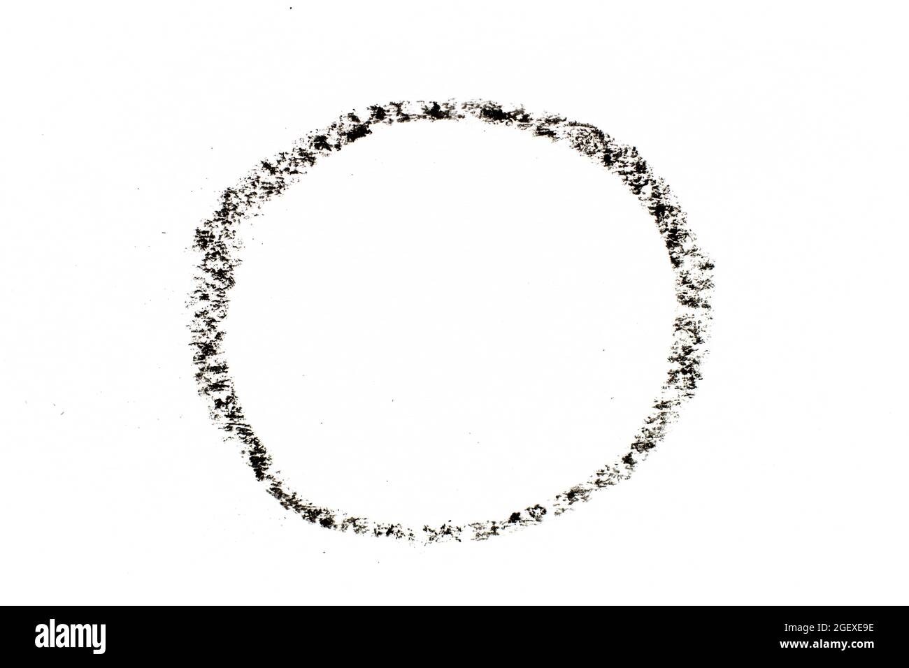 Black color oil pastel drawing in circle or round shape on white paper