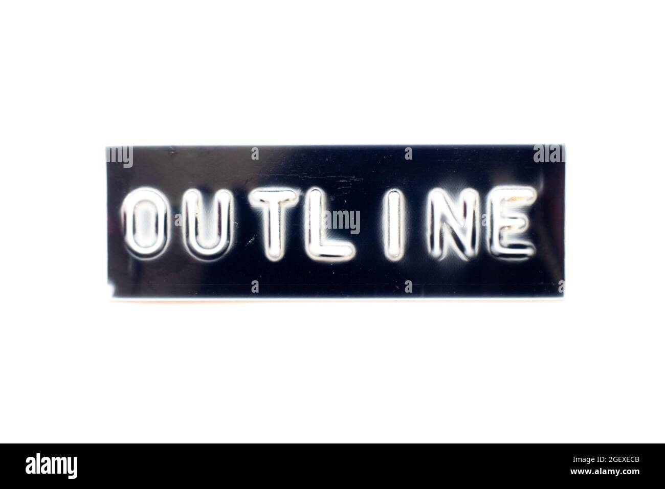 Embossed letter in word outline on black banner with white background