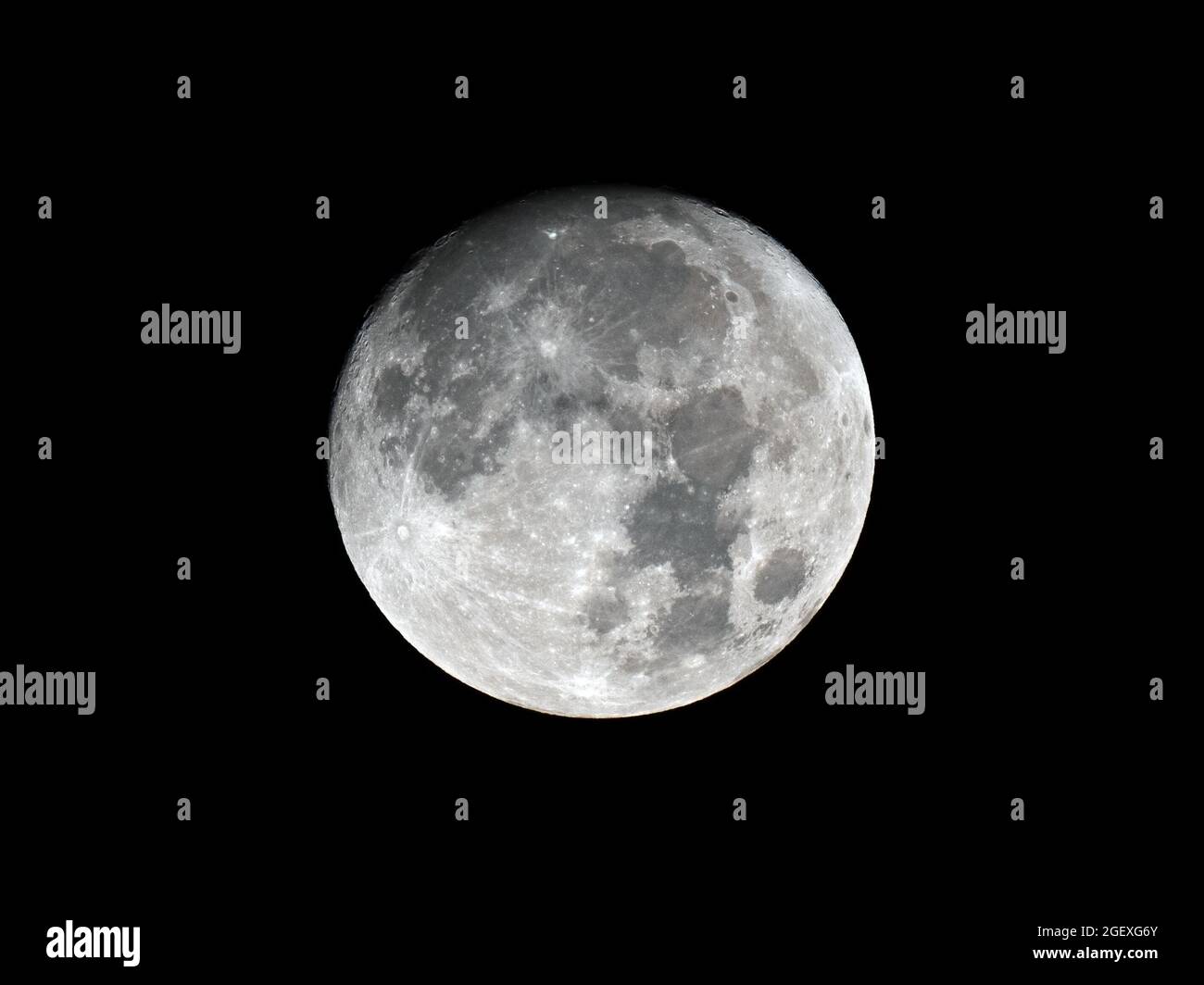 Waxing Gibbous Moon against Black Sky Stock Photo
