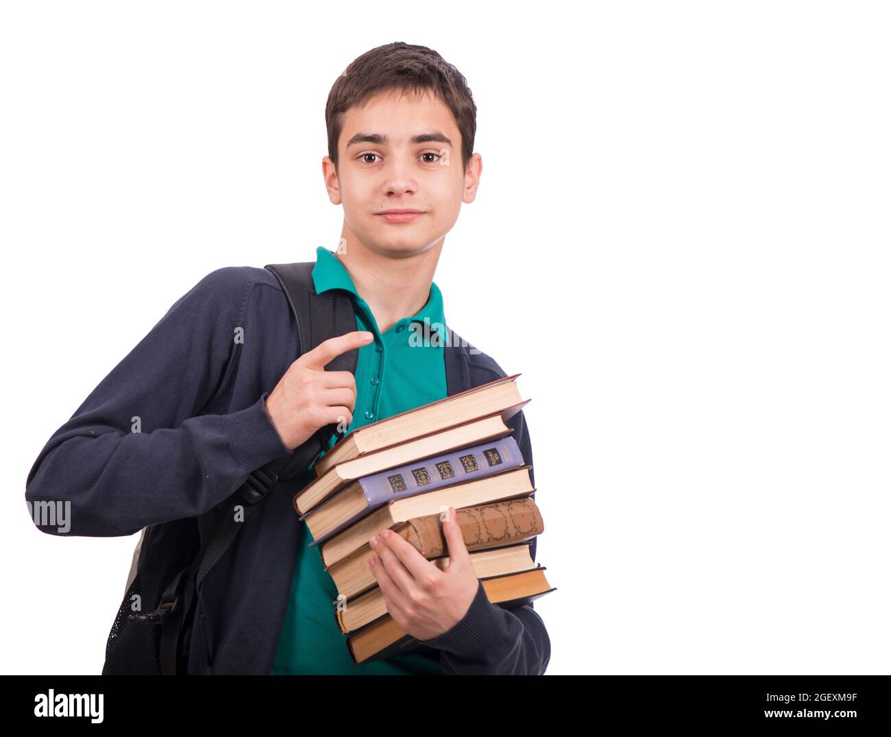schoolboy holding a stack of books, textbook isolated on white background . Close-up. Stock Photo