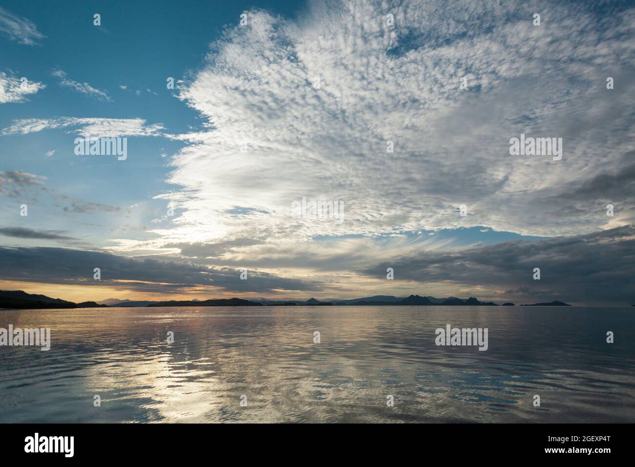 Sunset sky filled with cirrocumulus clouds  Stock Photo