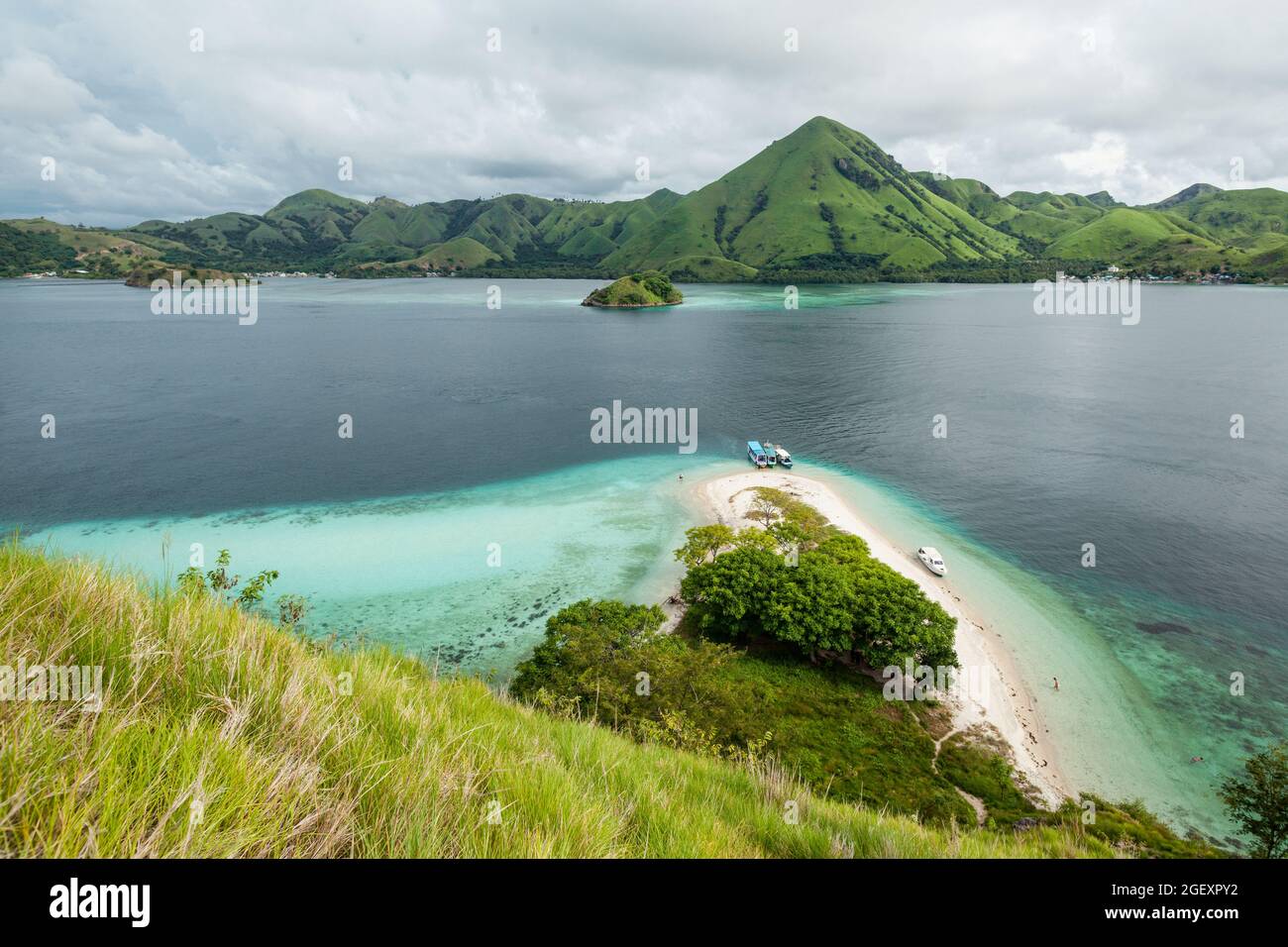 Stunning view on the green-capped mountains of Komodo island Stock Photo
