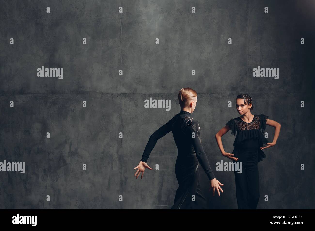 Young couple dancing in ballroom dance Paso doble. Stock Photo