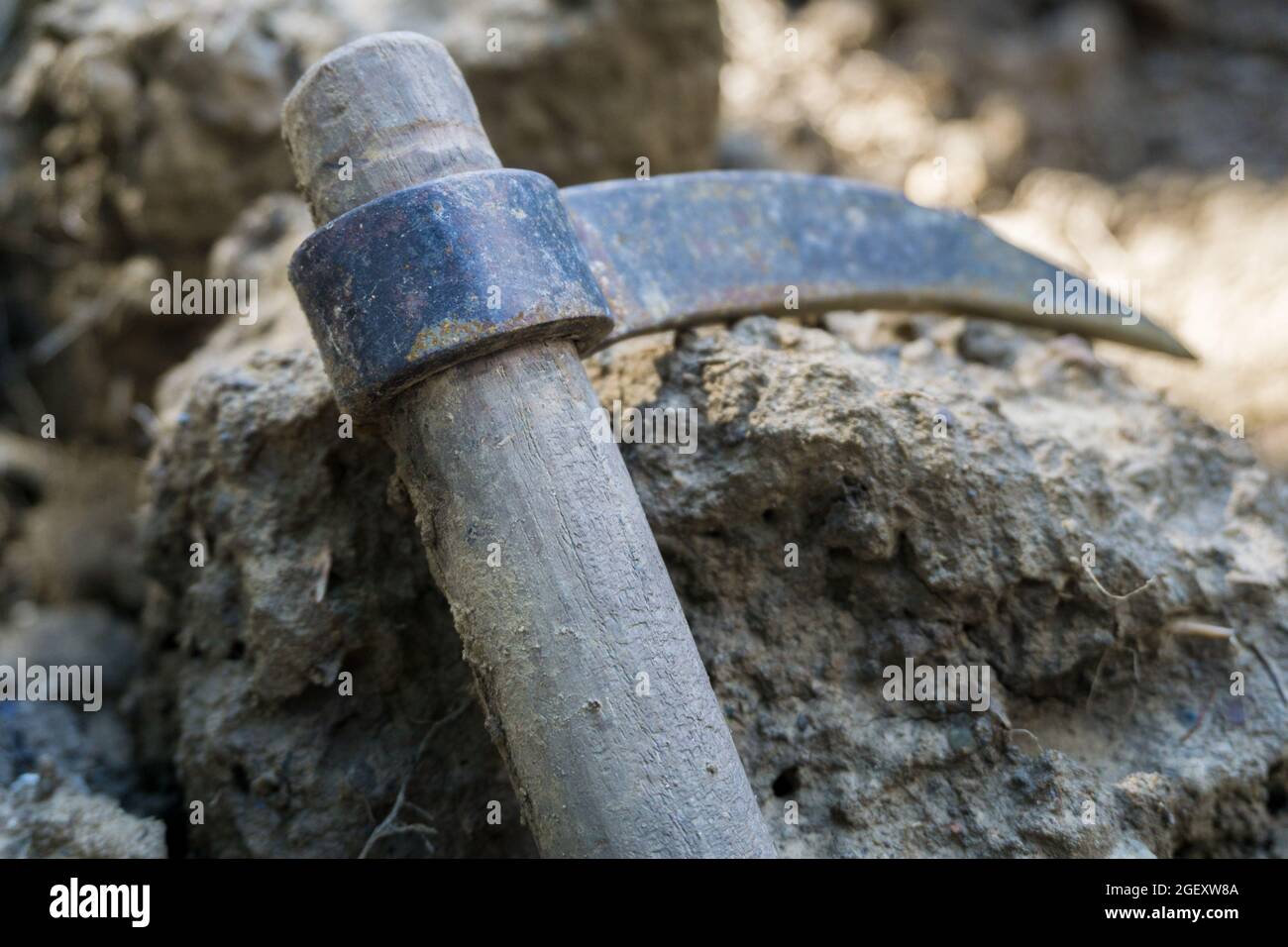 Miniature workers sharpen a pencil with a pickaxe Stock Photo - Alamy