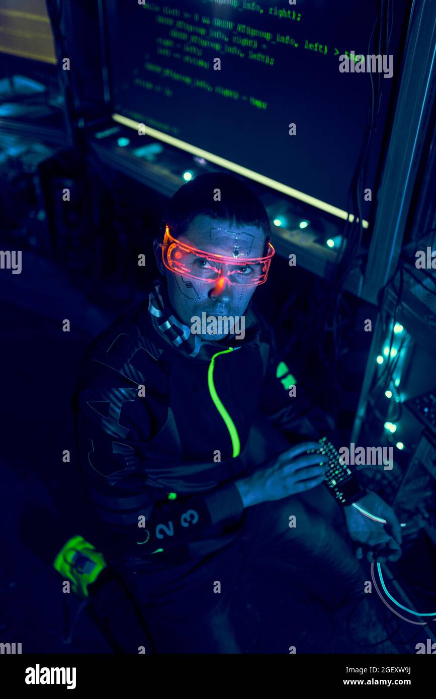 Cyber hacker breaks into databases to obtain information using a computer. Cybercrime and data security concept. Stock Photo