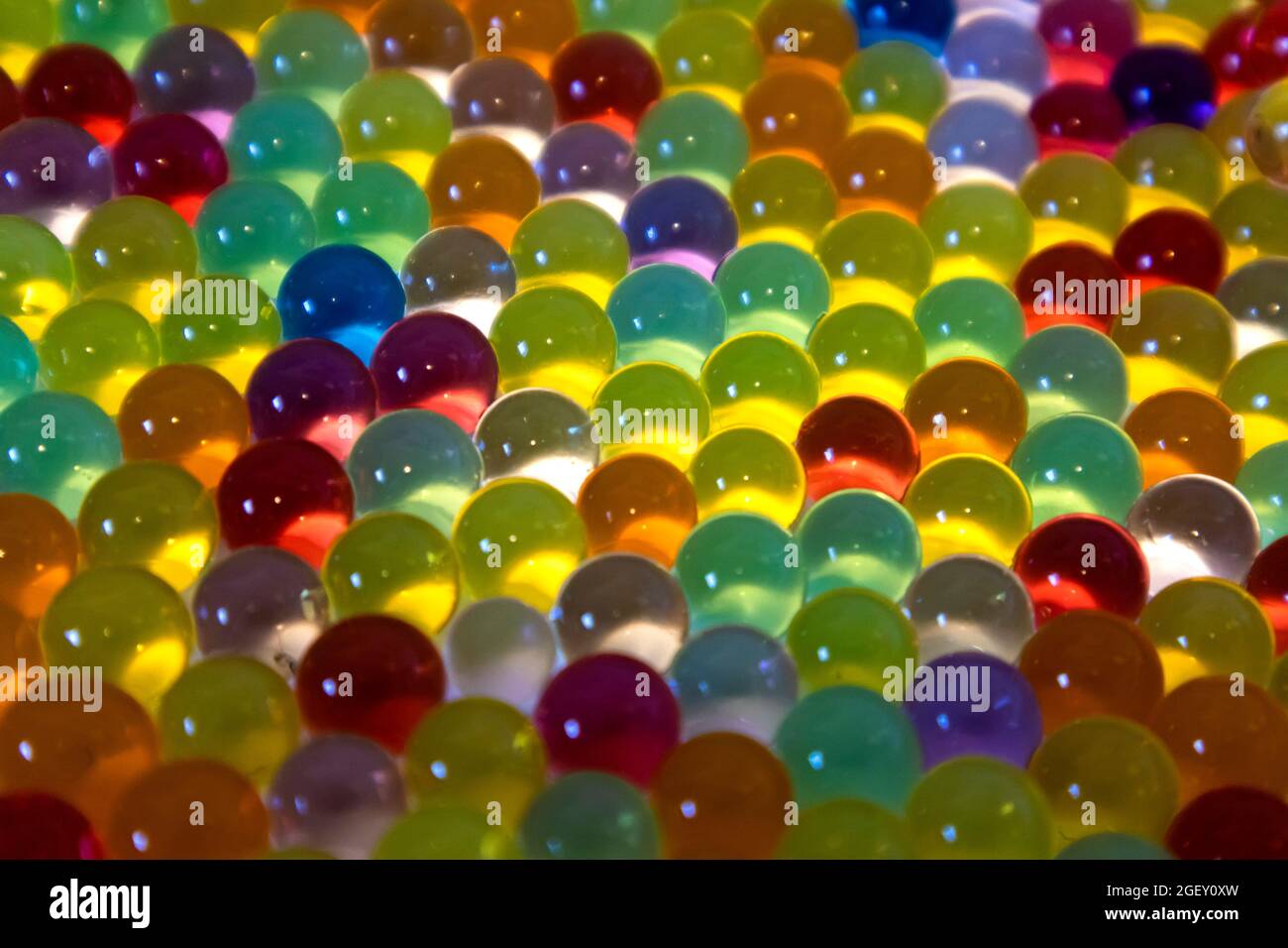 Lots of different colored hydrogel balls. Set of multicolored orbis. Crystal water beads for games. ideal for backgrounds or textures Stock Photo