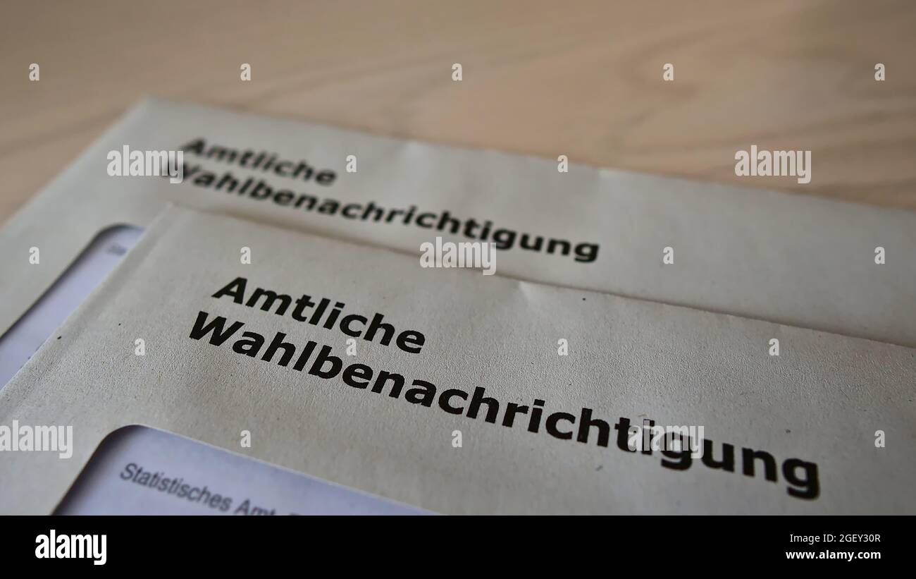 Letters with official polling cards (in German on envelope: 'amtliche Wahlbenachrichtigung') for the parliamentary elections in Germany in 2021. Stock Photo