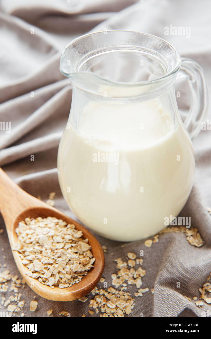Vegan non dairy alternative milk. Oat flakes milk Stock Photo Alamy