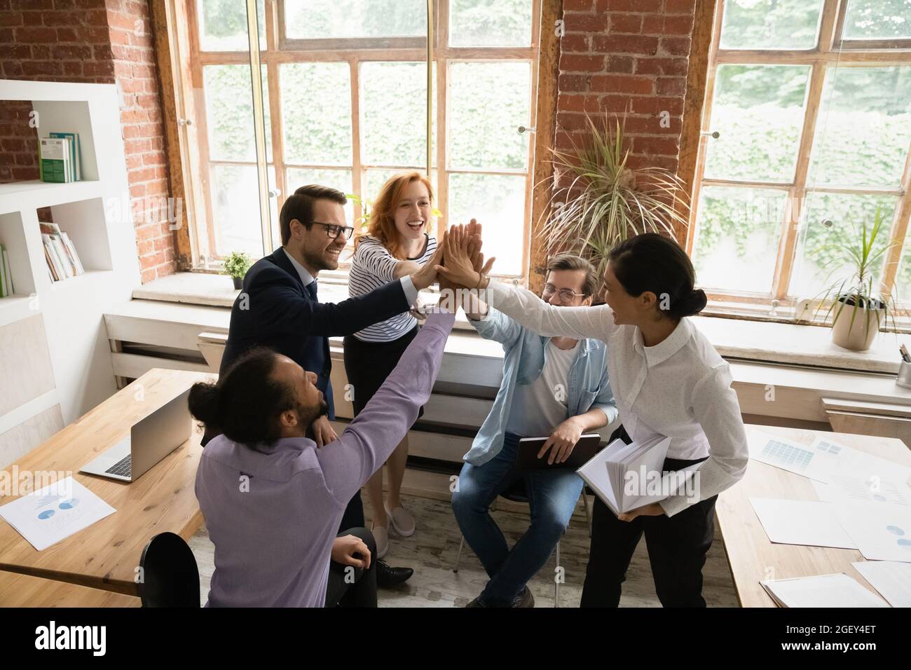 Top above view happy businesspeople giving high five celebrate success ...
