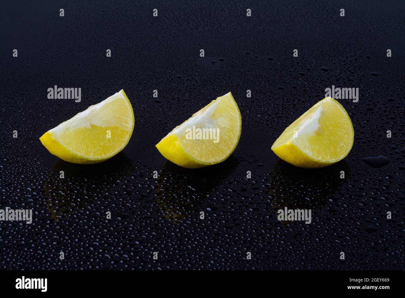 Lime fruit slices on black background Stock Photo