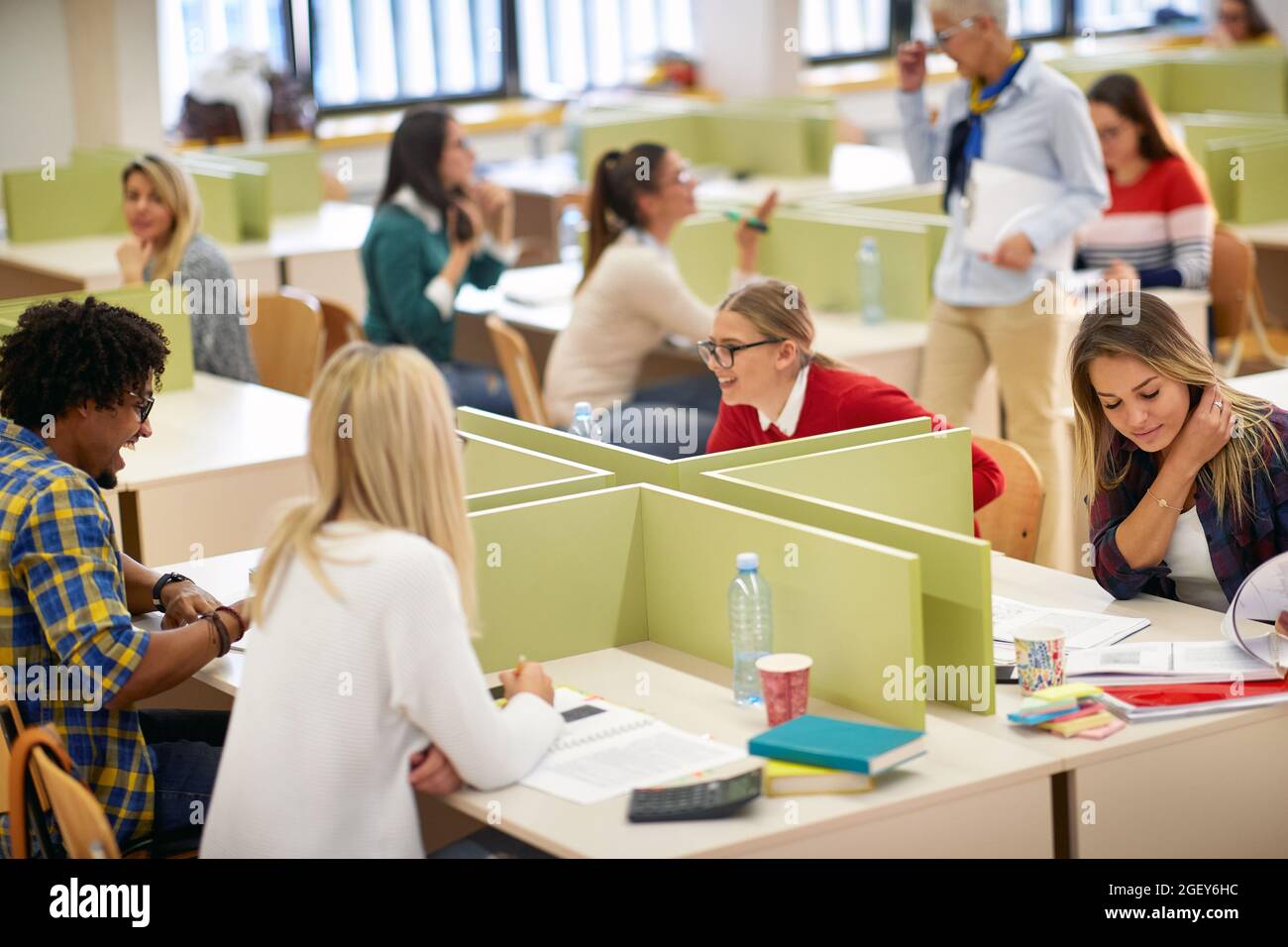 Students having good time at a lecture in a classroom Stock Photo