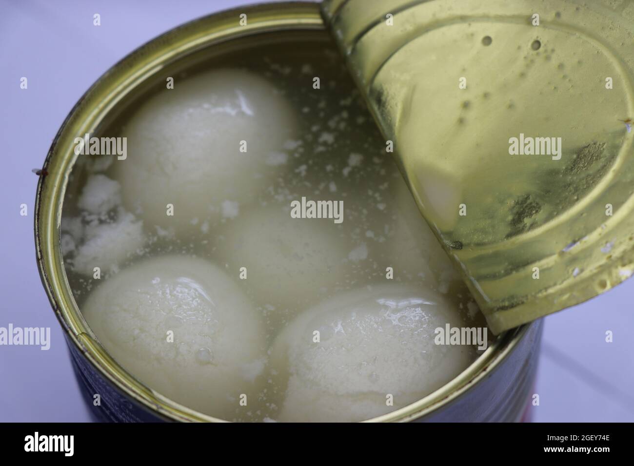 White rasgulla sweets view from a freshly opened can. Spongy rasgulla ...