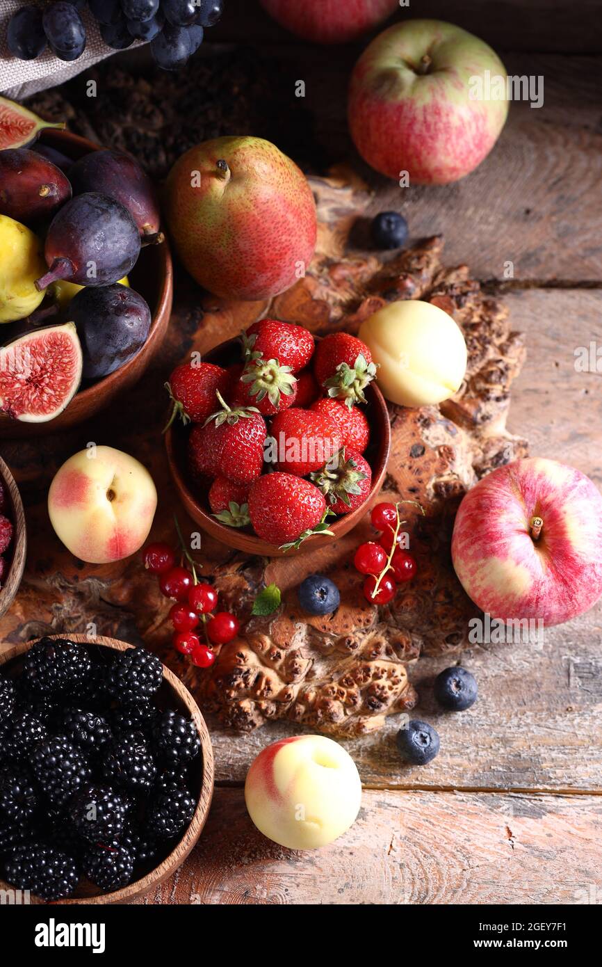 organic ripe assortment of berries and fruits, autumn harvest Stock ...