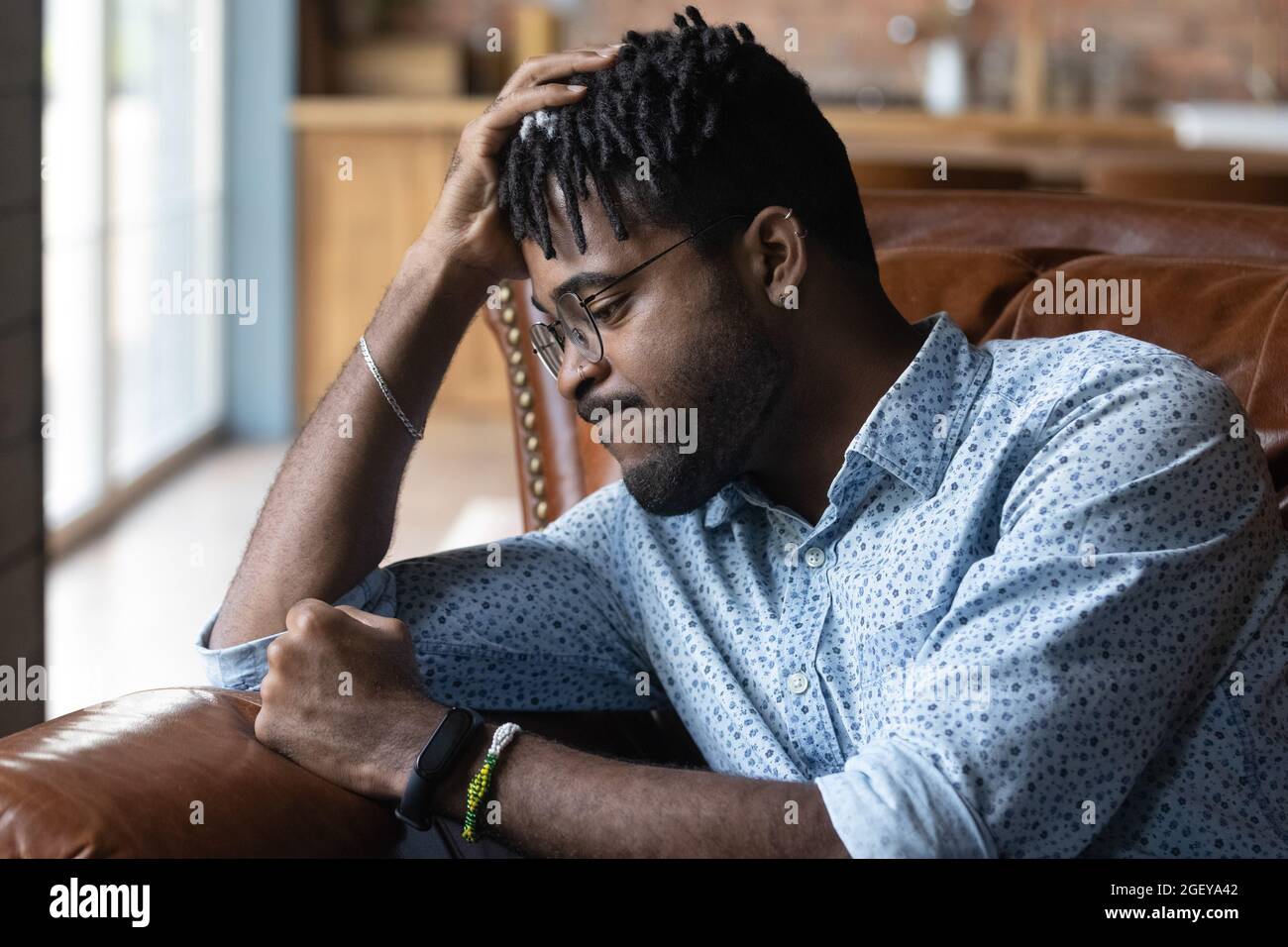 Frustrated disappointed Black guy feeling anger, regret Stock Photo