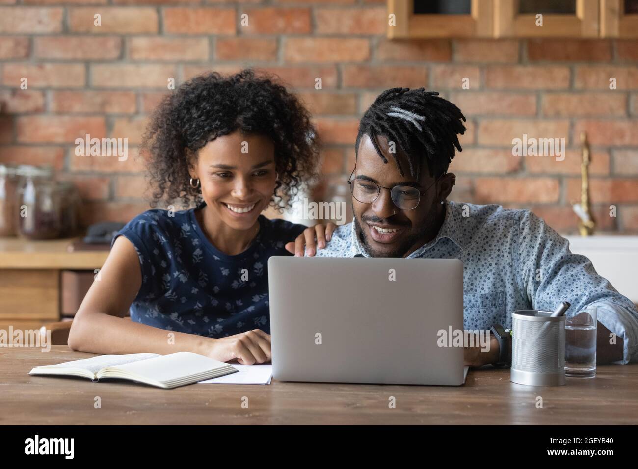 Young black couple reading hi-res stock photography and images - Alamy