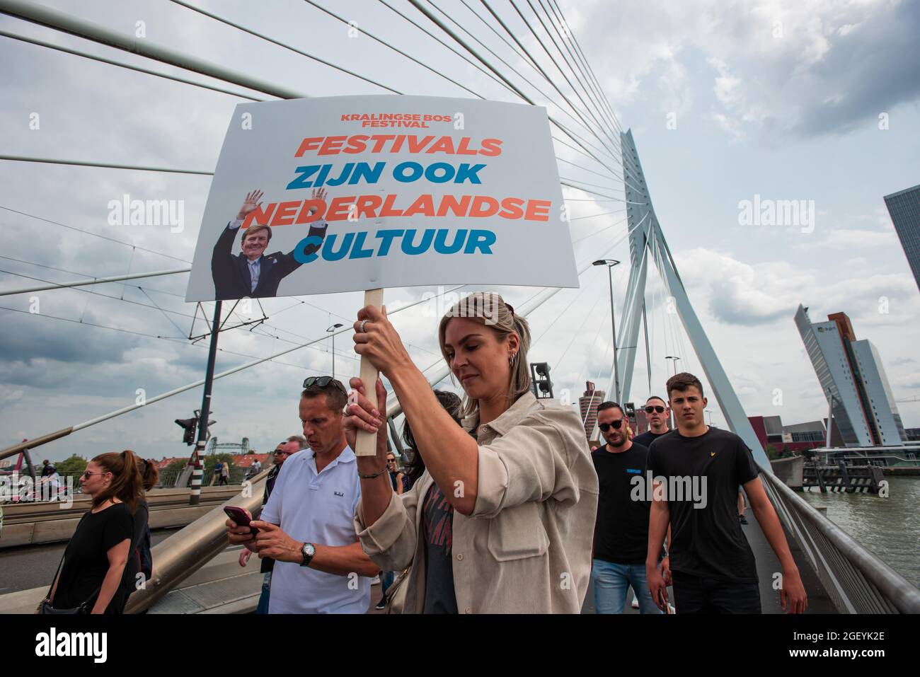 Rotterdam, Netherlands. 21st Aug, 2021. Erasmus Bridge, Rotterdam, Netherlands. Saturday 21st August, 2021. Tens of thousands or protesters took to the streets in six major cities' of the Netherlands today. The demonstrators showed their disapproval regarding government measures or restrictions relating to the entertainment sector and, the Covid-19 pandemic; restrictions they consider to be of double standards. Demonstrations are demanding the events sector should open its doors to full capacity as of Credit: Charles M Vella/Alamy Live News Stock Photo