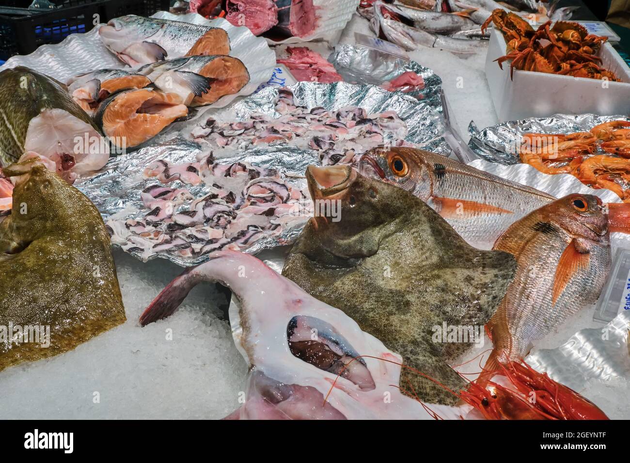 Fresh seafood and fish for sale at a market stall Stock Photo Alamy