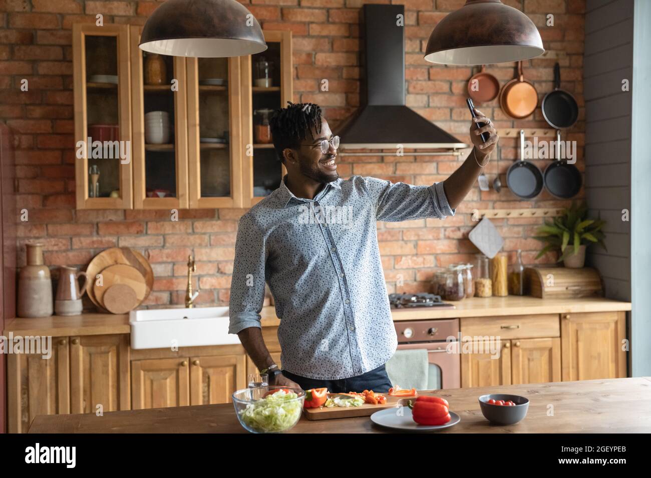 Happy Black hipster guy taking selfie on smartphone Stock Photo