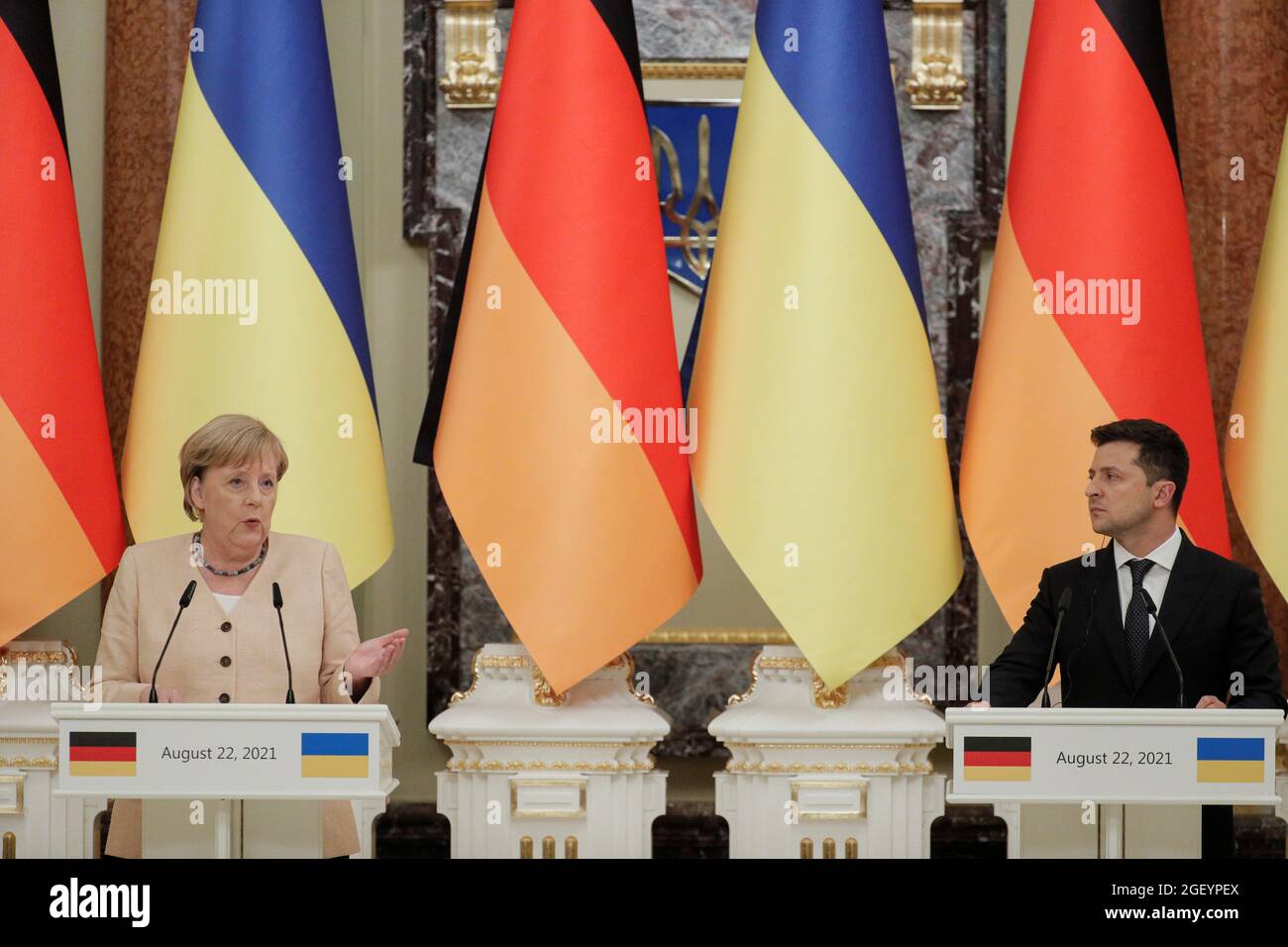 Ukrainian President Volodymyr Zelenskiy and German Chancellor Angela Merkel attend a joint news conference following their talks at the Mariyinsky Palace in Kyiv, Ukraine August 22, 2021. Sergey Dolzhenko/Pool via REUTERS Stock Photo