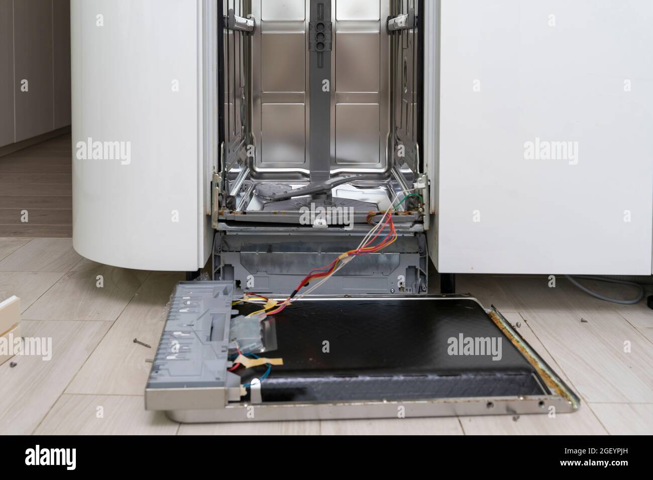 dishwasher in the kitchen disassembled for repair and cleaning from