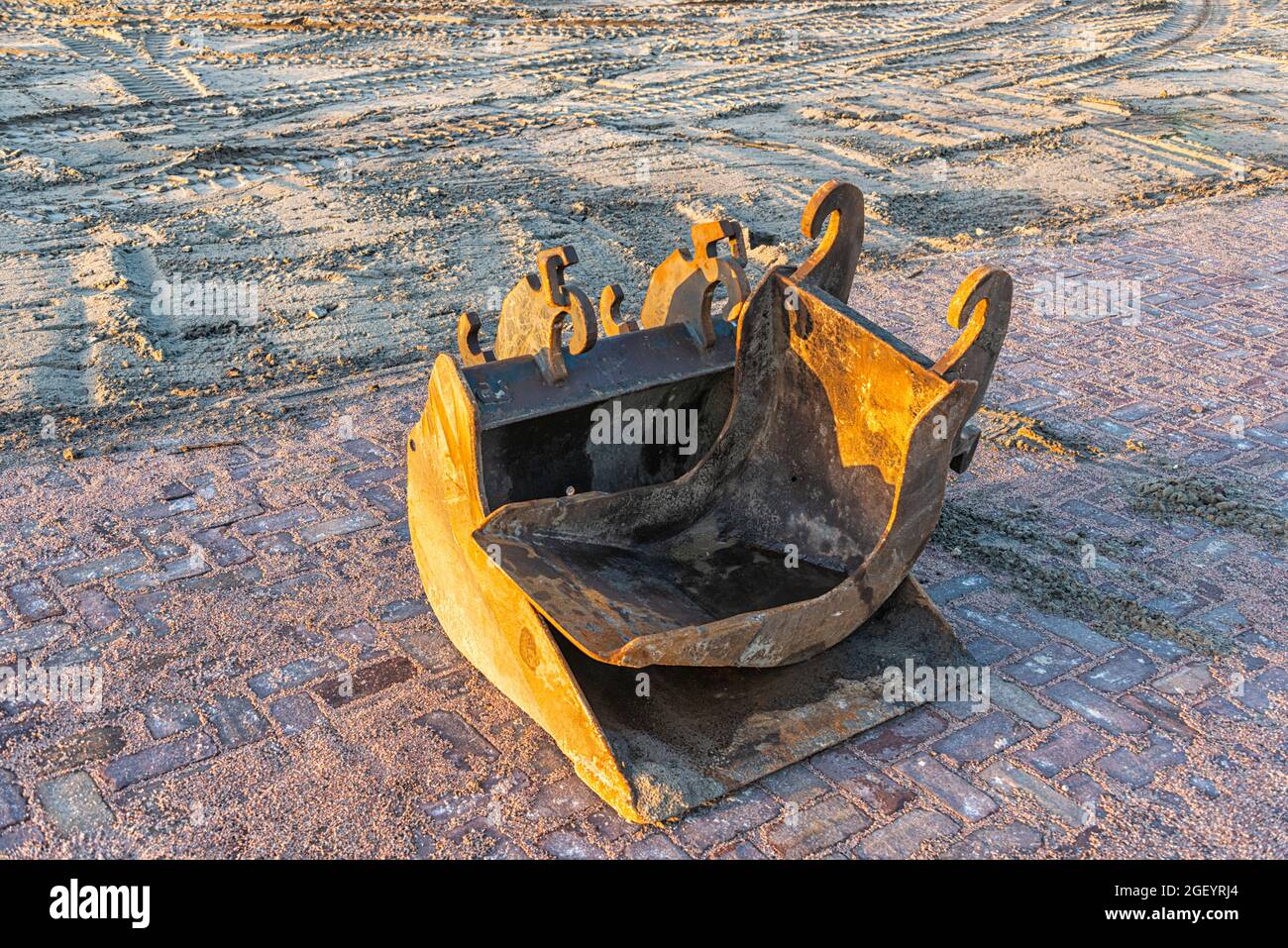 two separate shovel buckets from a shovel on a construction site on a construction site Stock Photo