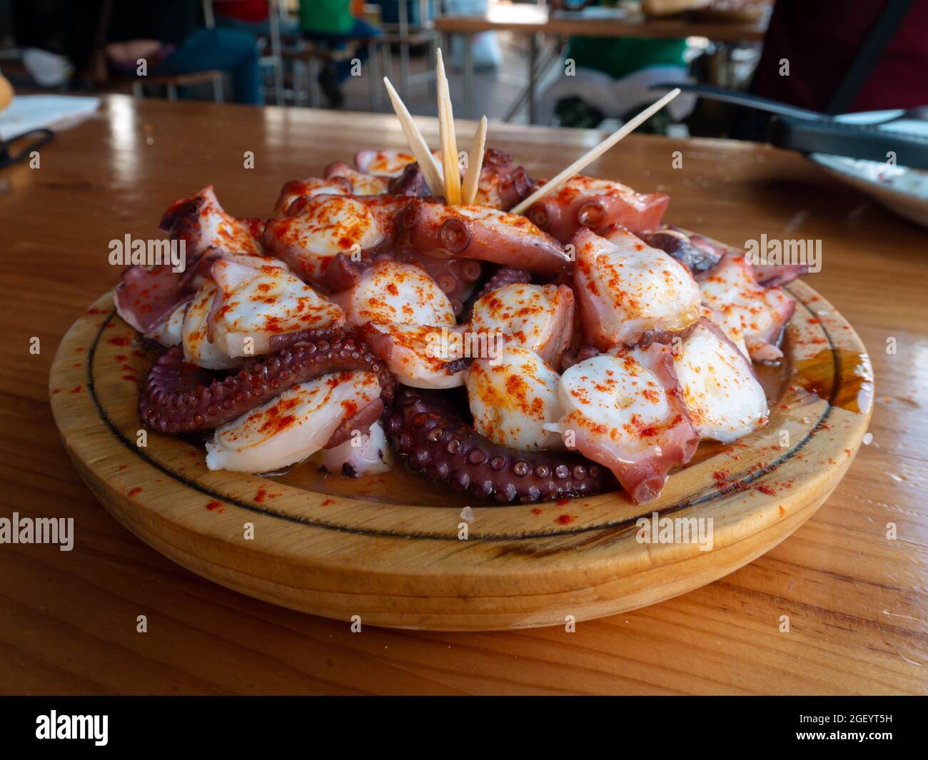 Pulpo a la gallega in Spanish meaning Galician-style octopus  or polbo a feira meaning fair-style octopus in gallego a traditional Galician dish. Stock Photo