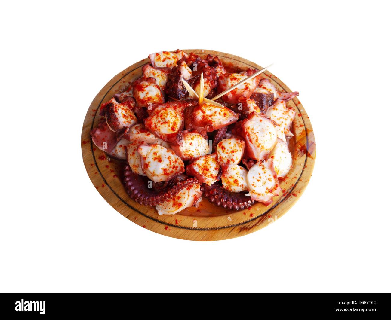 Pulpo a la gallega in Spanish meaning Galician-style octopus or polbo a feira meaning fair-style octopus in gallego. Isolated on white. Stock Photo