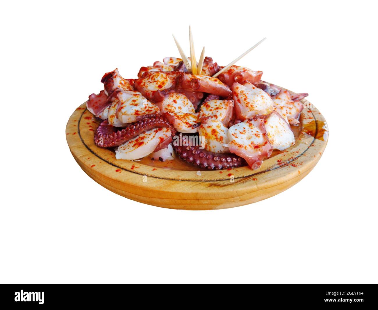 Pulpo a la gallega in Spanish meaning Galician-style octopus  or polbo a feira meaning fair-style octopus in gallego a traditional Galician dish. Isol Stock Photo