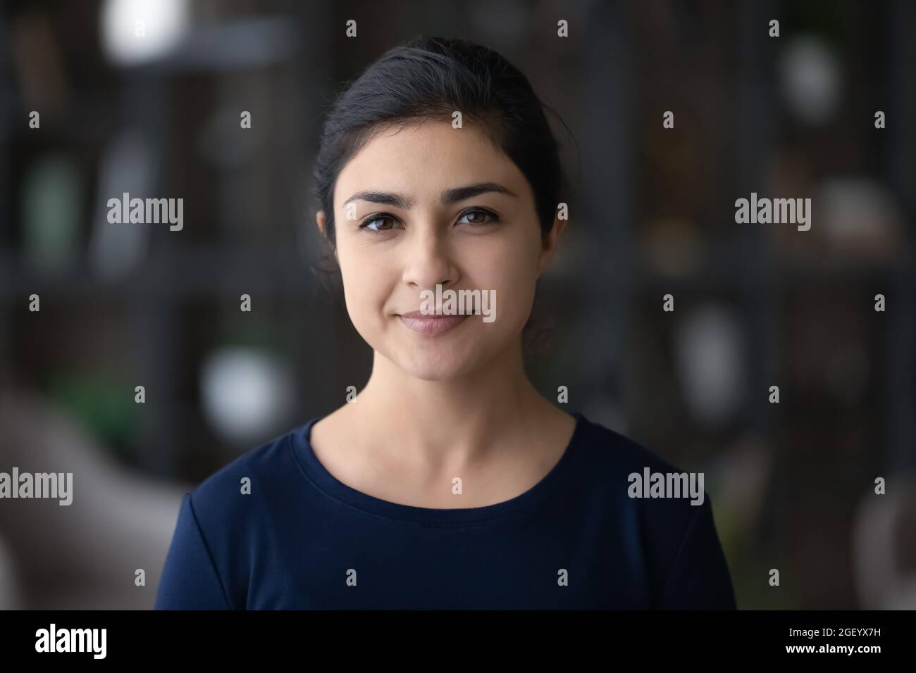 Headshot portrait of smiling Indian woman renter Stock Photo