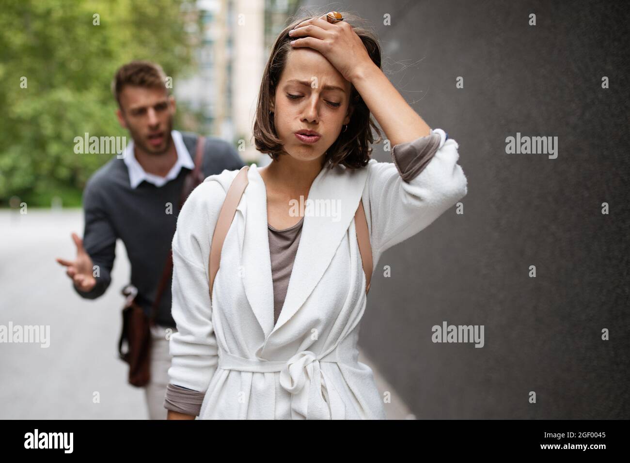 Breakup of couple with man and sad girlfriend outdoor. Divorce, couple, love, pain concept. Stock Photo