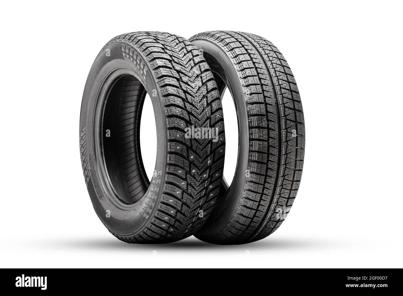winter tires wheels are new isolate. friction velcro wheel and studded tire next to two pieces. Stock Photo