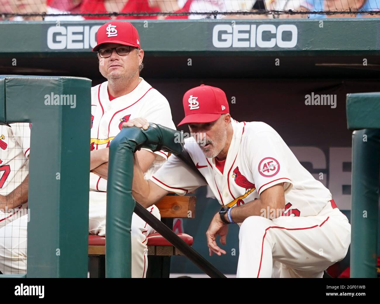 Shohei Ohtani (R) of the Los Angeles Angels hands his protective gear to a  ball boy after drawing a walk during the first inning of a baseball game  against the Texas Rangers