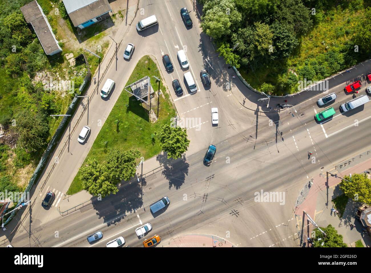 Top down aerial view of busy street intersection with moving cars ...
