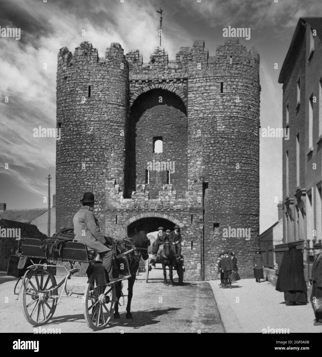 An early 20th century view of Saint Laurence's Gate, a barbican built in the 13th century as part of the walled fortifications of the medieval town of Drogheda on the border of counties Meath and Louth in Ireland. Stock Photo