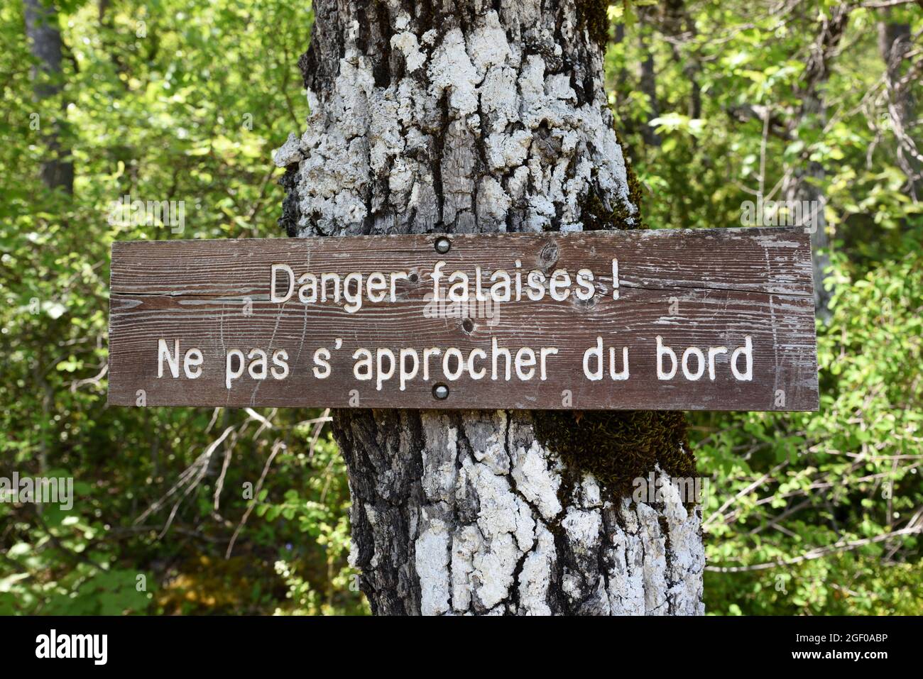 Wooden Warning Sign or Danger Sign Warning About Danger of Cliffs or Cliff Edge in Verdon Gorge Nature Reserve Alpes-de-Haute-Provence Provence France Stock Photo