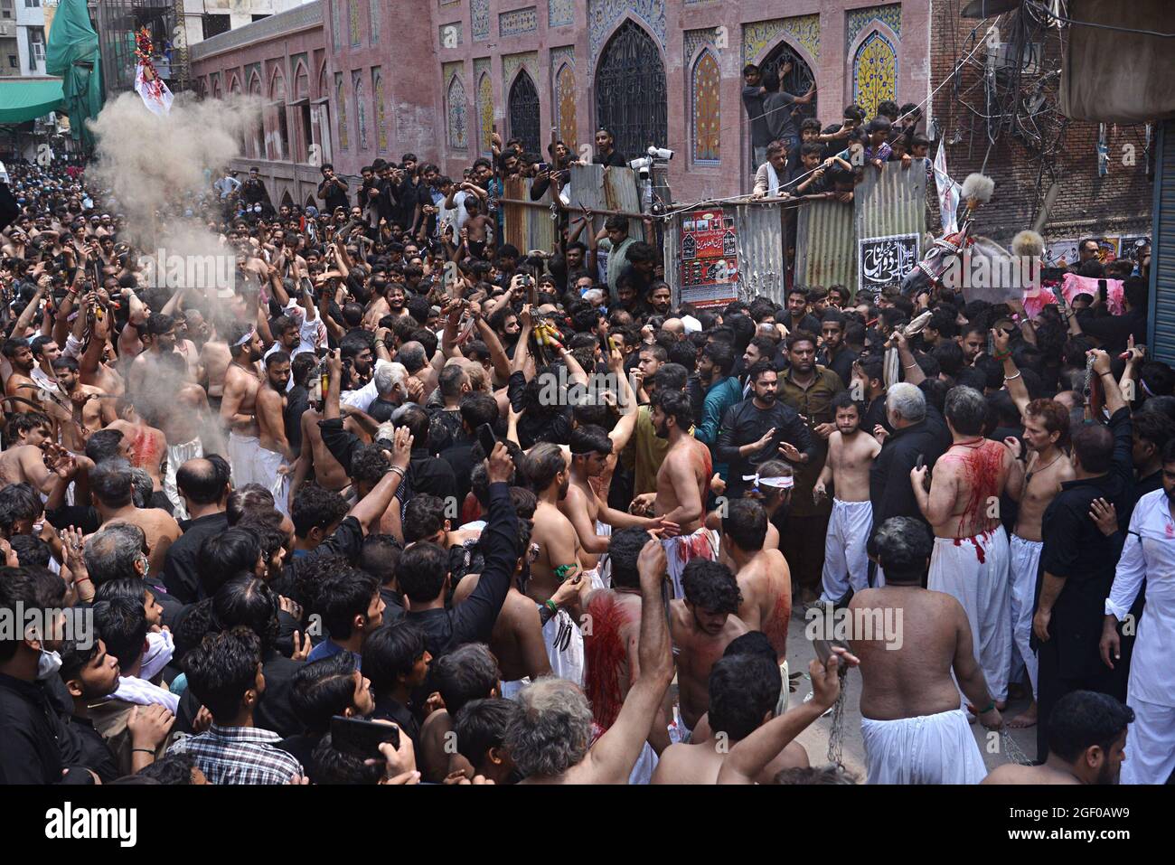 (8/19/2021) Pakistani Shiite Muslim take a part in a procession to mark ...