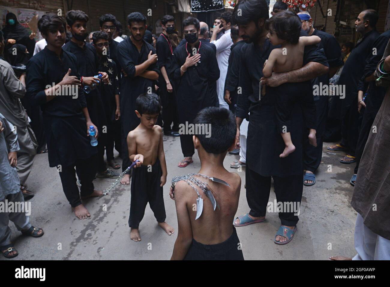 (8/19/2021) Pakistani Shiite Muslim take a part in a procession to mark ...