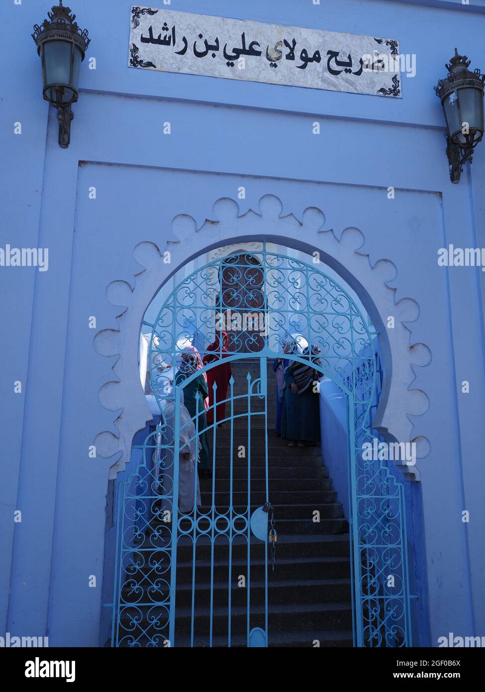 CHEFCHAOUEN, MOROCCO on APRIL 2019: Arabian entrance gate in african town in warm sunny spring day - vertical Stock Photo