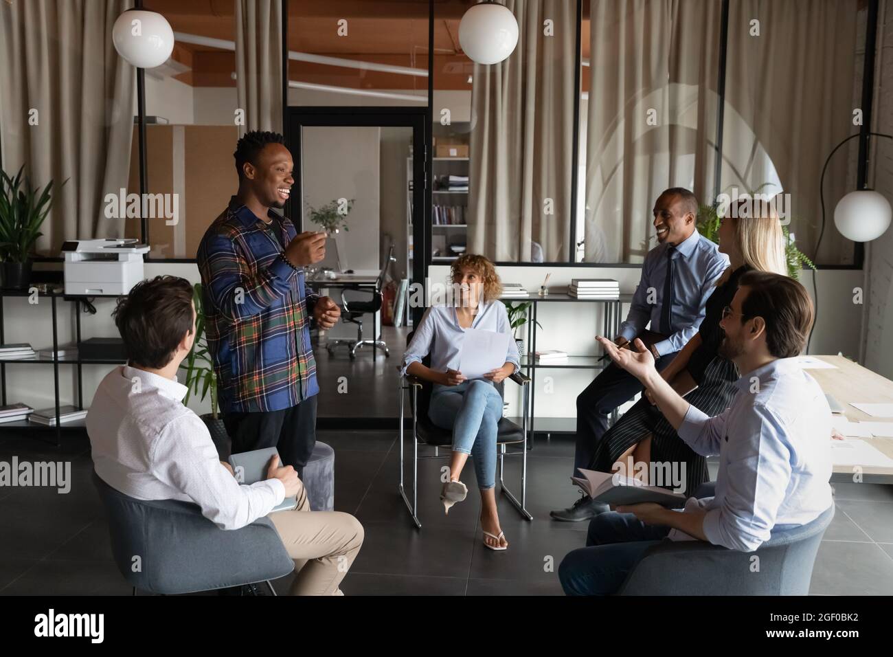 Smiling multiracial colleagues have team meeting in office Stock Photo ...