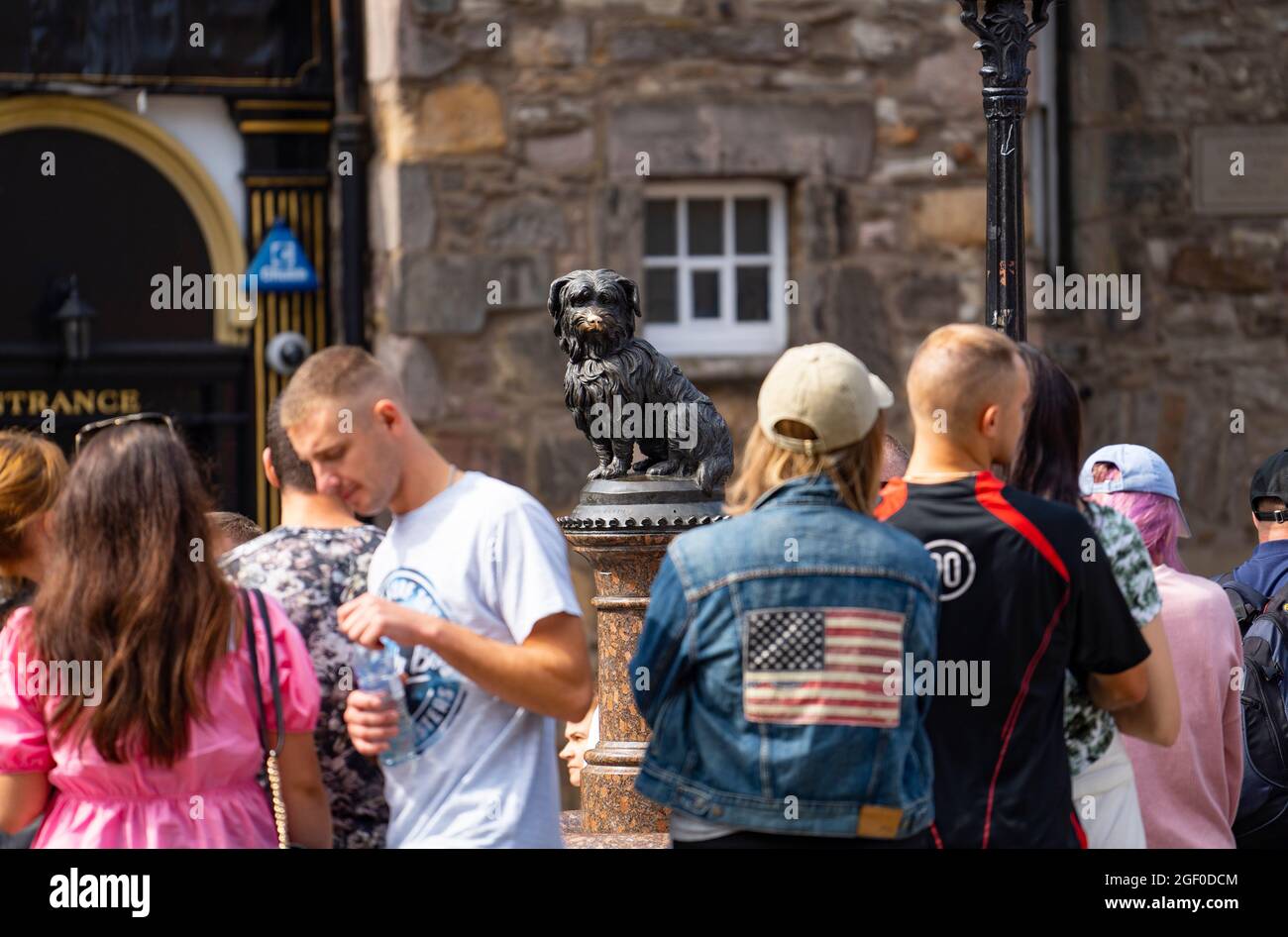 Edinburgh, Scotland, UK. 22nd August 2021. Good weather brought many visitors to Edinburgh during the festival and many came to pay respects to the Greyfriars Bobby statue on Candlemaker Row in the Old Town. . Iain Masterton/Alamy Live News. Stock Photo