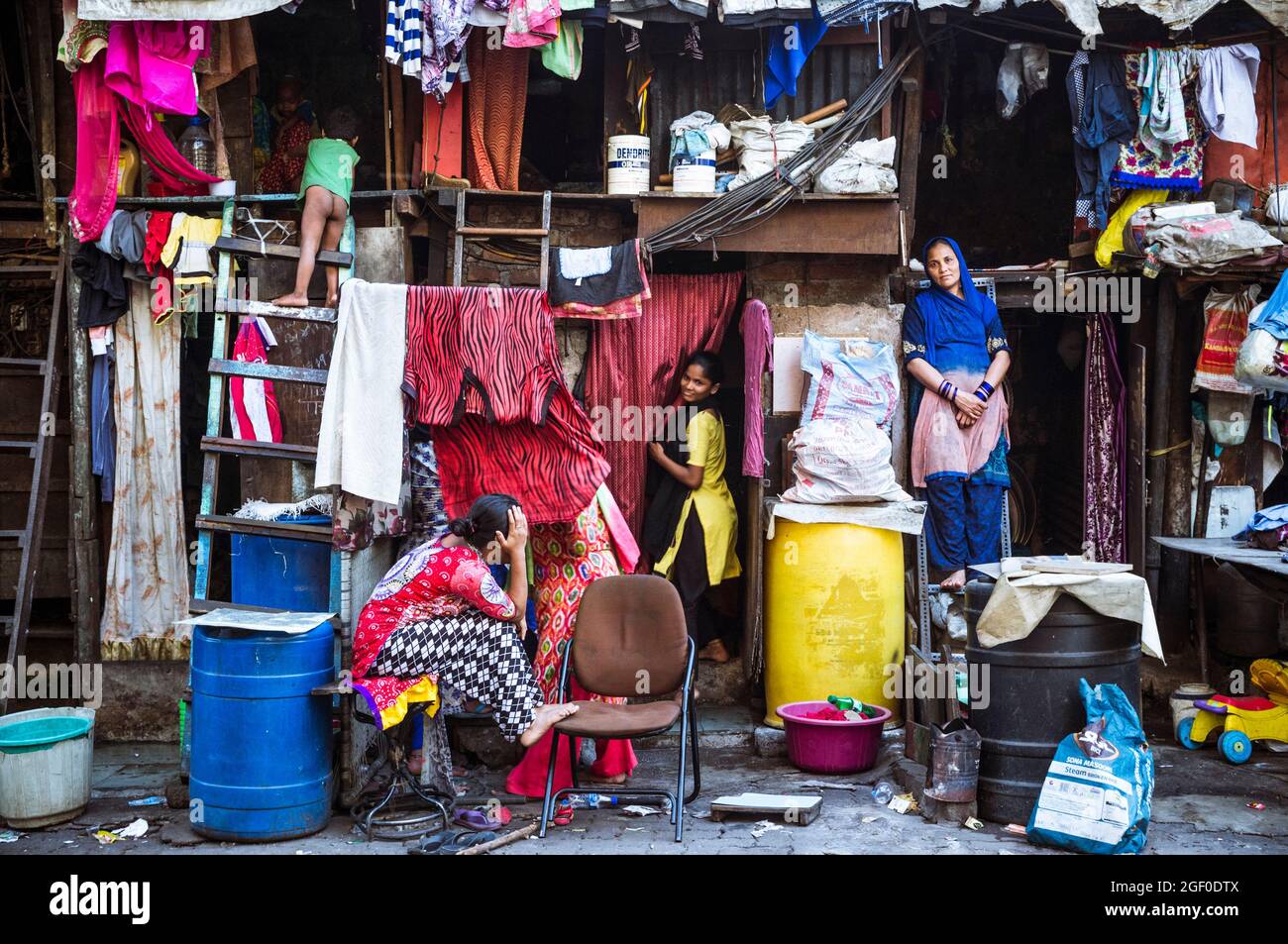 Mumbai, Maharashtra, India : Women stand outside their house at a slum in the Byculla district. Stock Photo