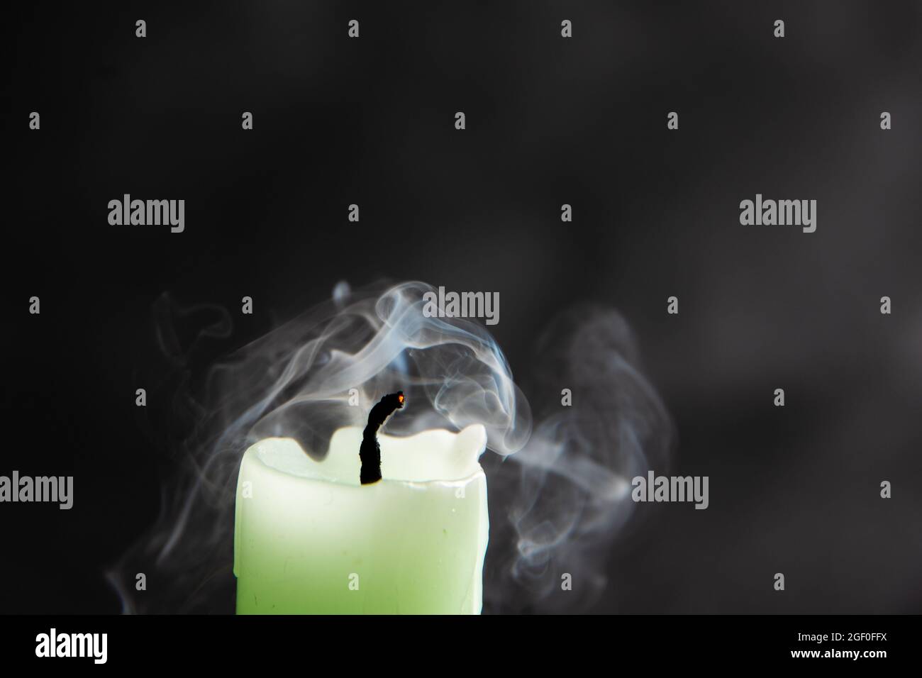 Smoke from a candle on a black isolated background. An interesting and