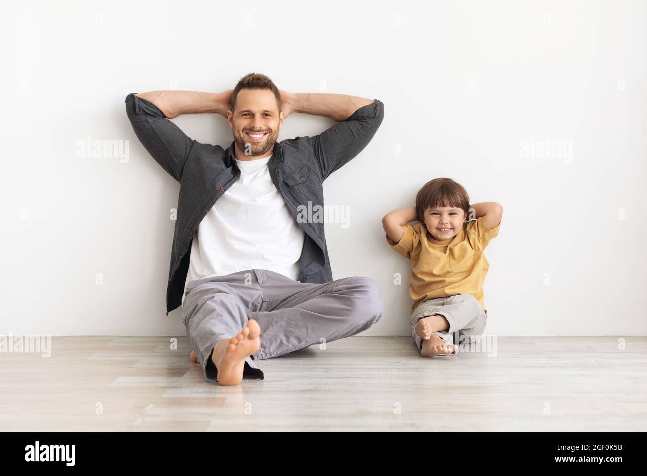 Little Smiling Boy Sitting Barefoot, Isolated On White Stock Photo, Picture  and Royalty Free Image. Image 6207823.