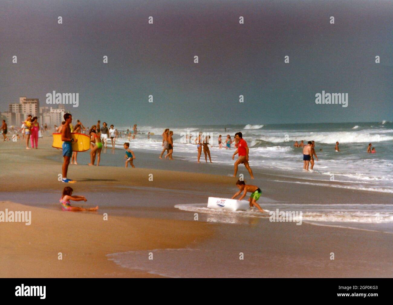 Families enjoying the beach in Ocean City, Maryland in the late 1980s Stock Photo
