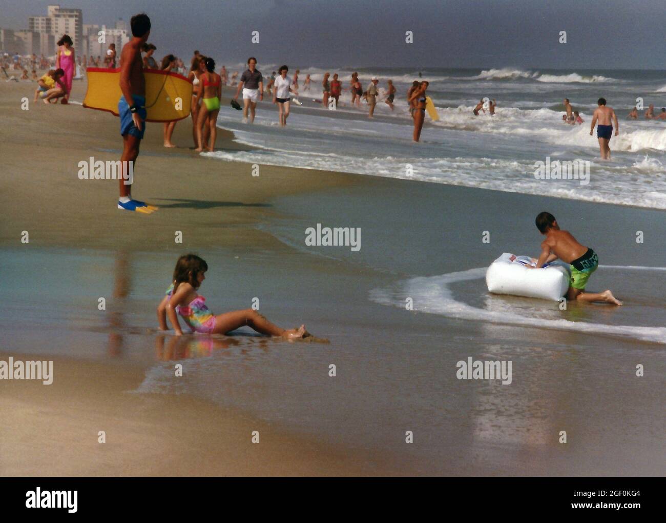 Families enjoying the beach in Ocean City, Maryland in the late 1980s Stock Photo