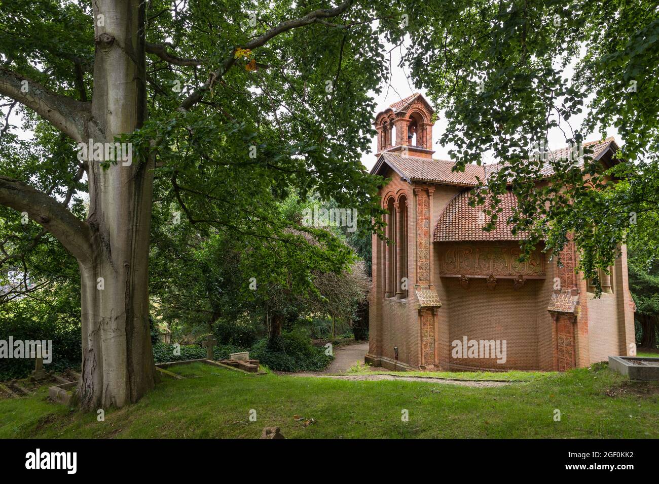View of the arts and crafts Watts Cemetery Chapel in the trees