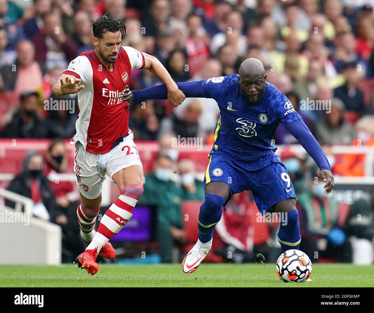 Arsenal's Pablo Mari (left) and Chelsea's Romelu Lukaku battle for the ball during the Premier League match at the Emirates Stadium, London. Picture date: Sunday August 22, 2021. Stock Photo
