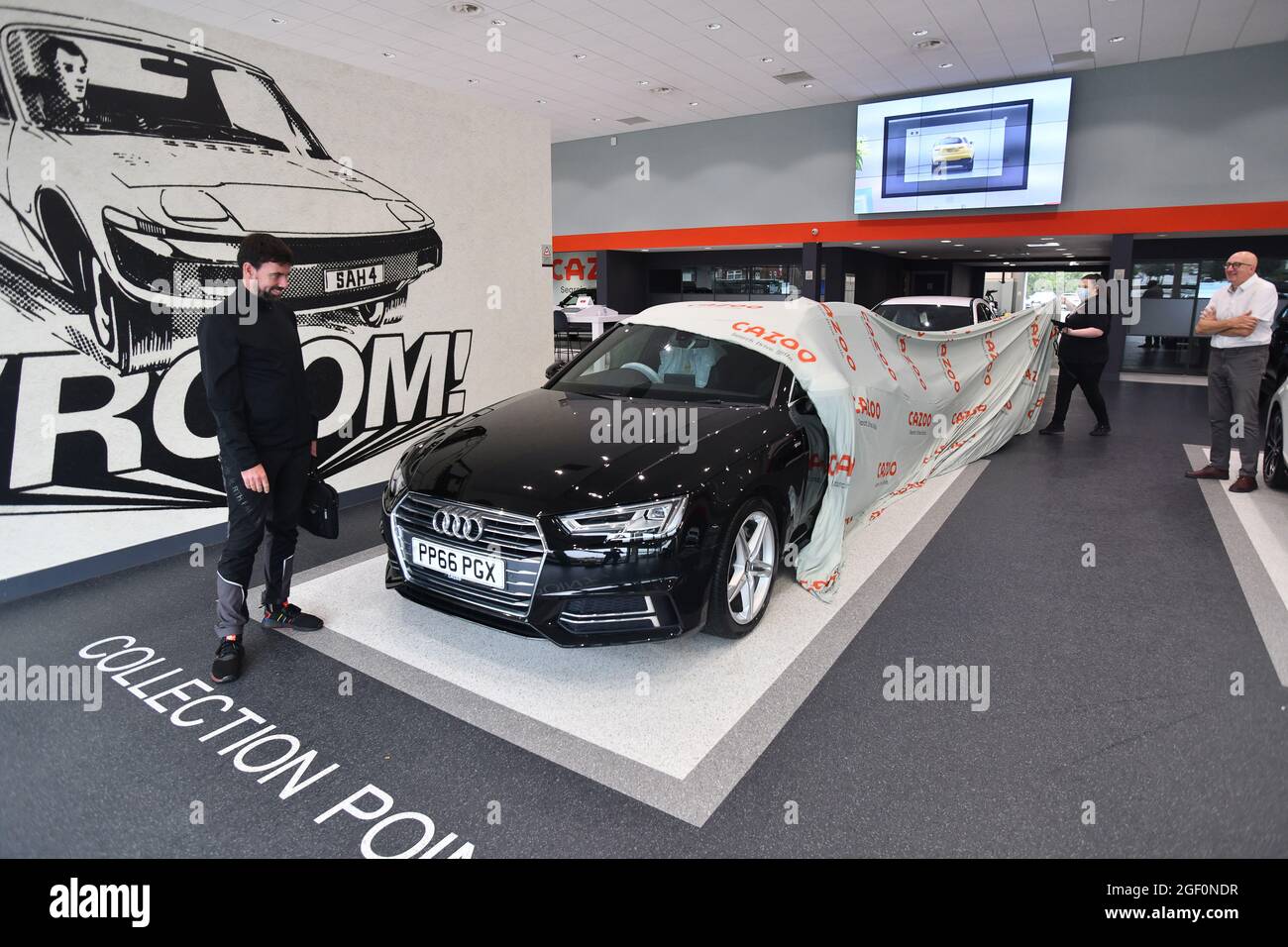 Customer collecting second hand car bought at Cazoo. Buying a used car Britain Uk Stock Photo