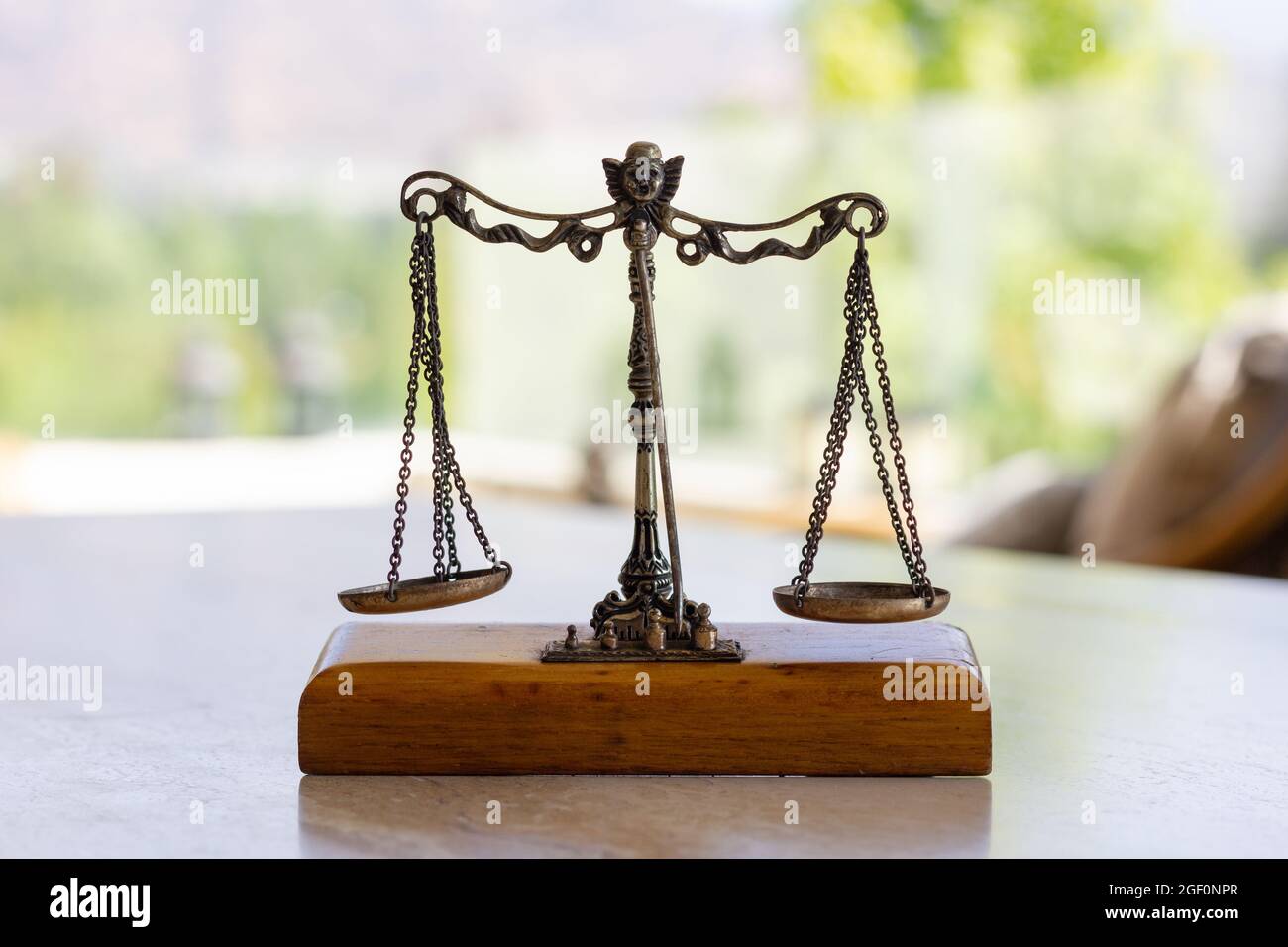Weighing scale miniature. Weigh instrument, law, justice concepts Stock Photo